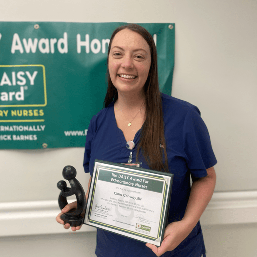Ciara Conway holding award